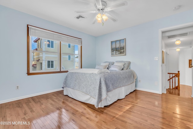 bedroom with hardwood / wood-style flooring and ceiling fan