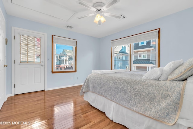 bedroom featuring hardwood / wood-style flooring and ceiling fan