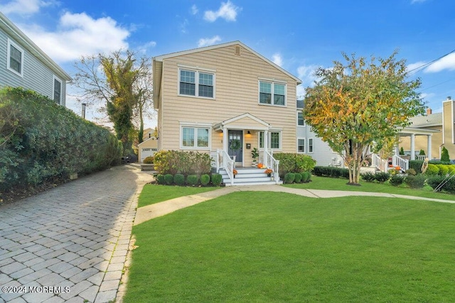 view of front of home with a front lawn