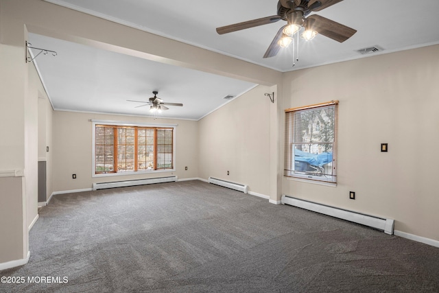 carpeted empty room with crown molding, vaulted ceiling, and a baseboard heating unit