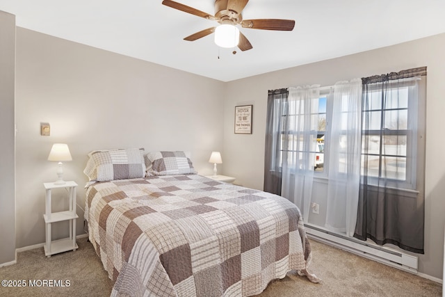 carpeted bedroom featuring a baseboard heating unit and ceiling fan