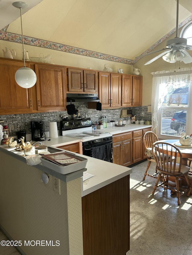 kitchen featuring electric range oven, pendant lighting, lofted ceiling, backsplash, and kitchen peninsula