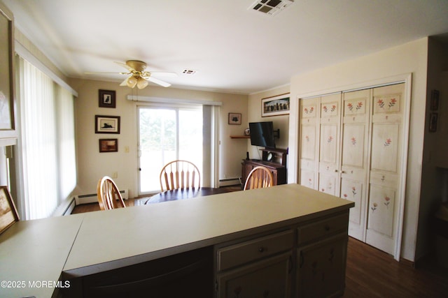 kitchen with baseboard heating, ceiling fan, dark wood-type flooring, and dark brown cabinets