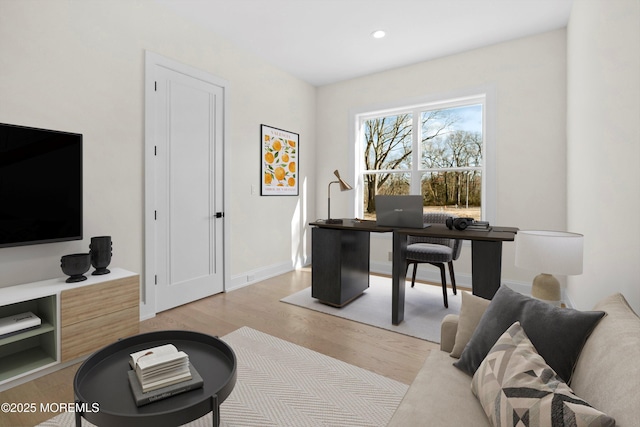 office with light wood-style floors, recessed lighting, and baseboards