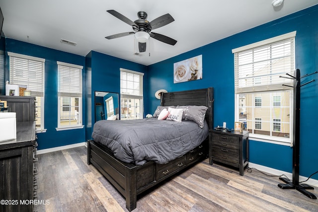 bedroom featuring hardwood / wood-style floors and ceiling fan