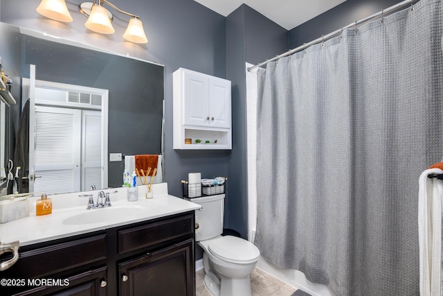 bathroom featuring vanity, a shower with shower curtain, and toilet