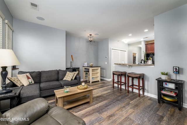 living room featuring dark wood-type flooring