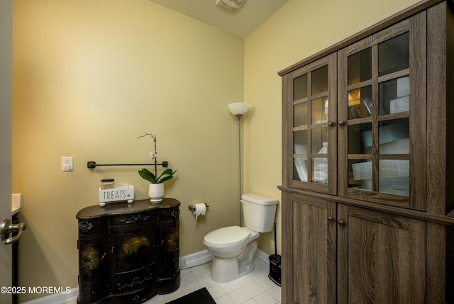 bathroom featuring tile patterned flooring and toilet