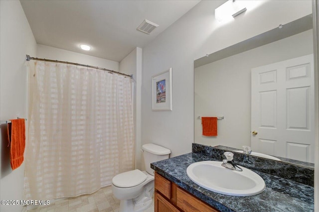 bathroom featuring vanity, a shower with curtain, and toilet