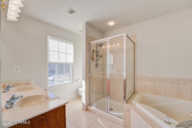 full bathroom with vanity, tile patterned flooring, shower with separate bathtub, and toilet