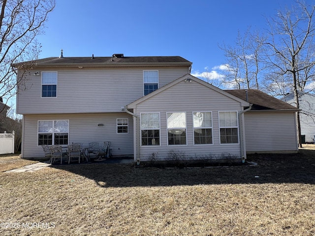 rear view of property featuring a patio