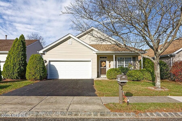 view of front facade featuring a garage and a front lawn