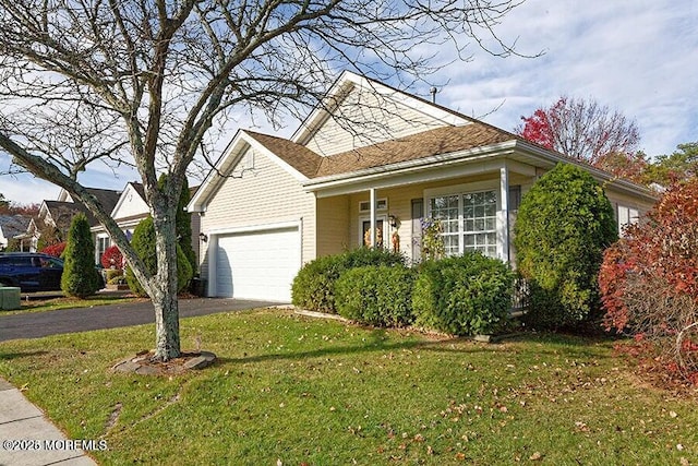 view of front property with a garage and a front lawn