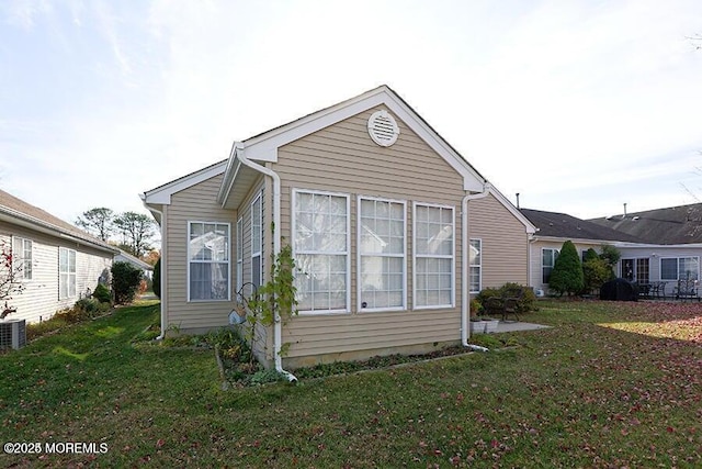 view of side of property featuring a yard