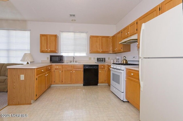 kitchen featuring sink and white appliances