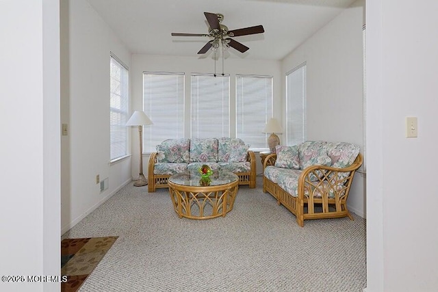 sunroom featuring ceiling fan