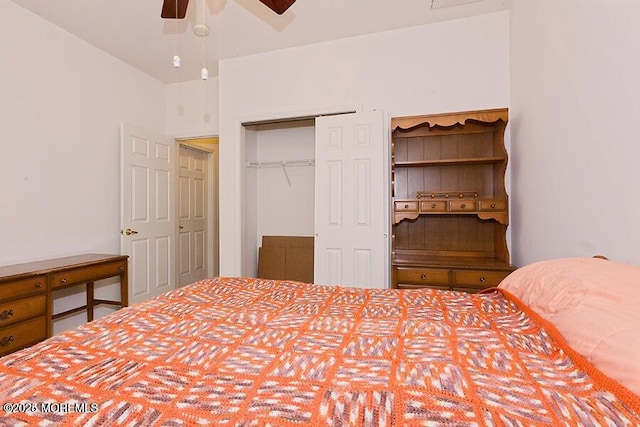 bedroom with ceiling fan and a closet