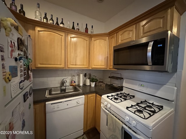 kitchen featuring white appliances, sink, and decorative backsplash