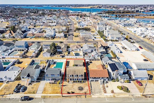 birds eye view of property featuring a water view