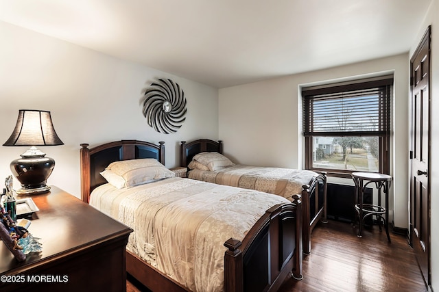 bedroom featuring dark hardwood / wood-style flooring