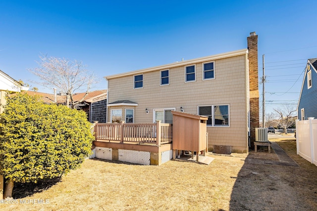 back of house featuring a deck and central AC unit