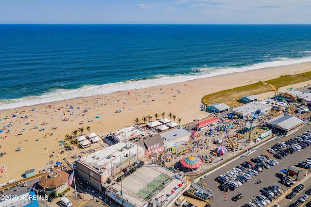 bird's eye view with a water view and a view of the beach