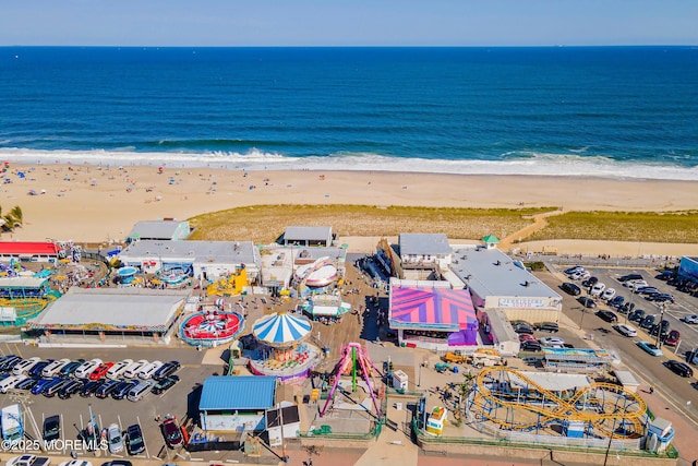 bird's eye view featuring a beach view and a water view