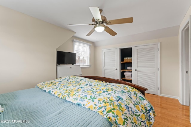 bedroom featuring a closet, ceiling fan, and light hardwood / wood-style flooring