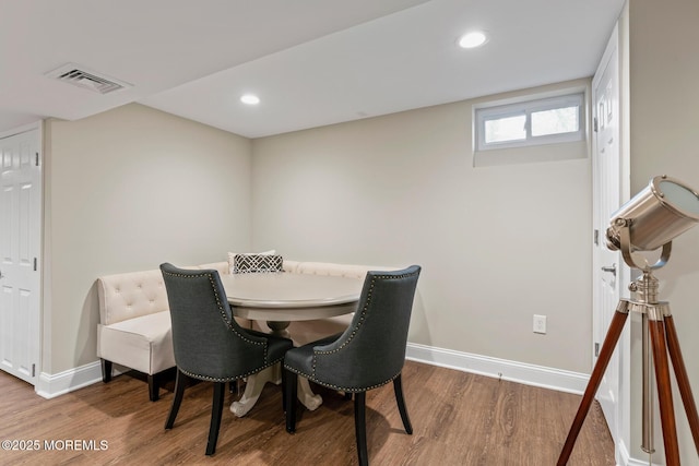 dining area with hardwood / wood-style floors