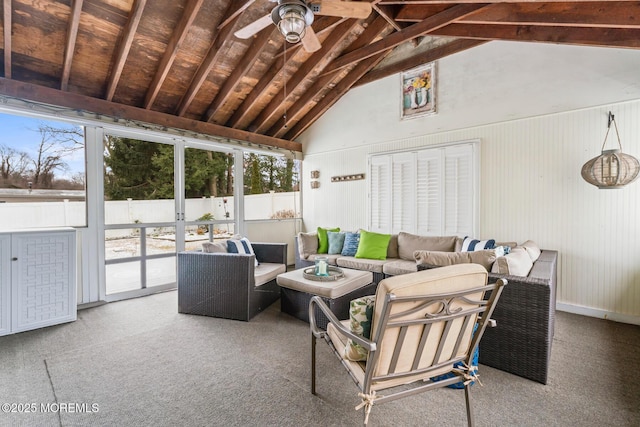 sunroom with vaulted ceiling with beams and ceiling fan