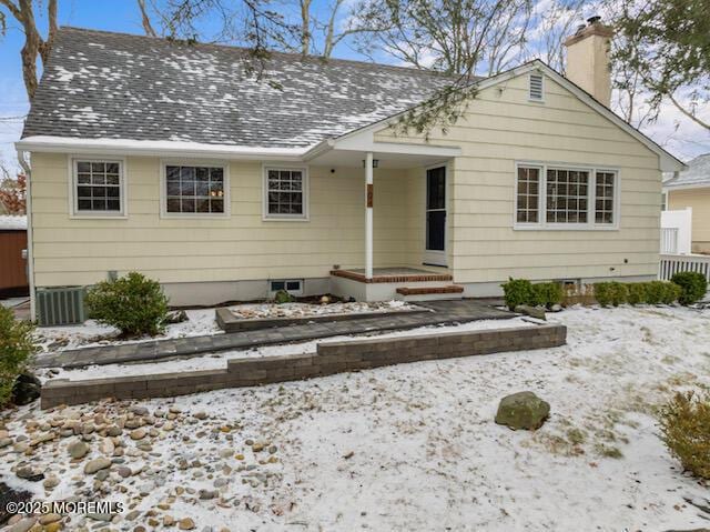 view of front of home featuring central AC unit and a porch