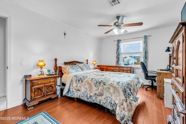 bedroom with ceiling fan and light wood-type flooring