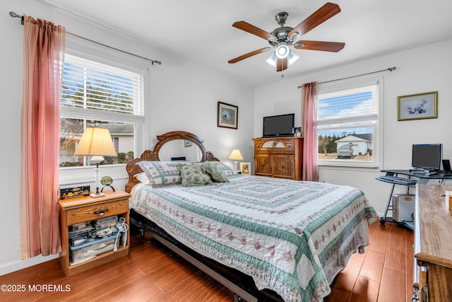 bedroom featuring hardwood / wood-style floors and ceiling fan