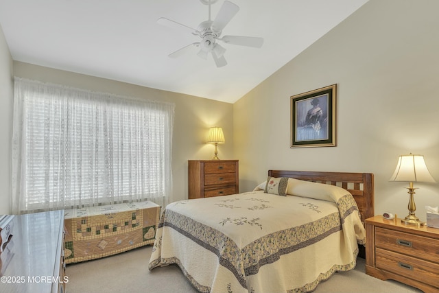 bedroom featuring carpet, lofted ceiling, and ceiling fan