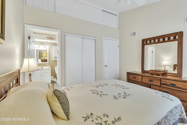 bedroom featuring ensuite bathroom and a closet