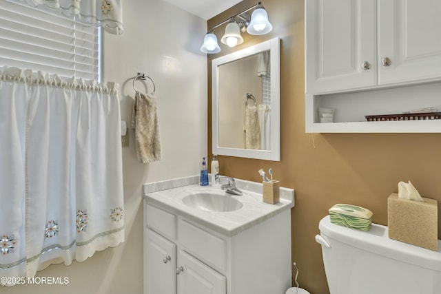 bathroom with vanity and toilet