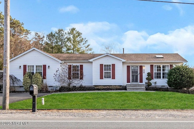 ranch-style home featuring a front yard