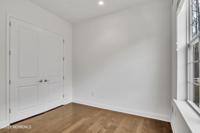 unfurnished bedroom featuring hardwood / wood-style floors