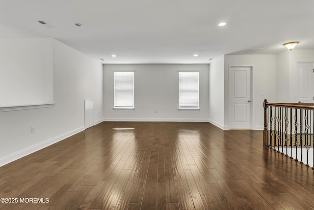 empty room featuring dark wood-type flooring