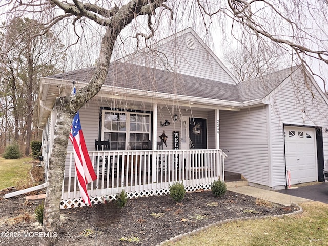 view of front of house with a garage and a porch