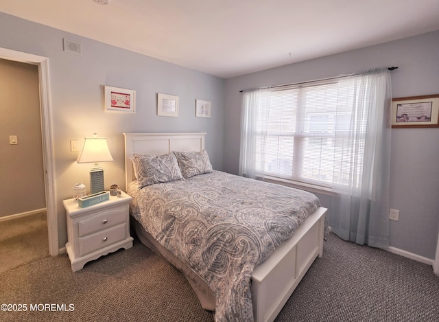 bedroom with dark carpet