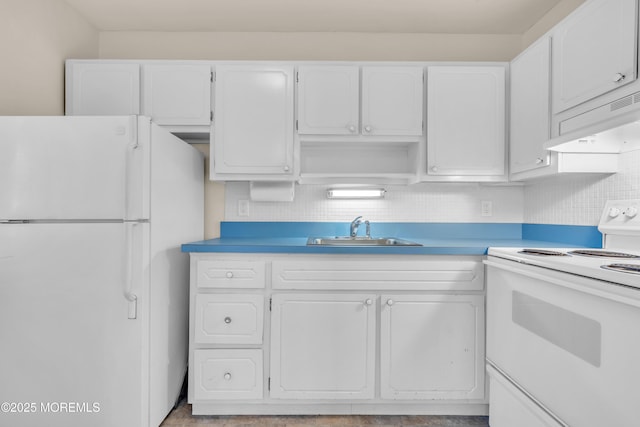 kitchen featuring white cabinetry, sink, and white appliances