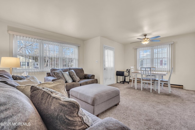 living room featuring light colored carpet and ceiling fan