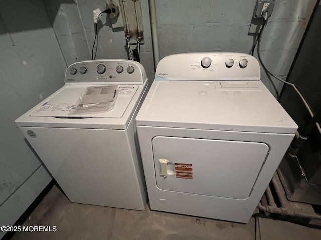 laundry area featuring washing machine and clothes dryer