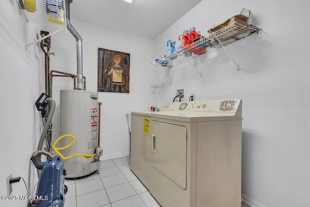 washroom with separate washer and dryer, light tile patterned floors, a textured ceiling, and gas water heater