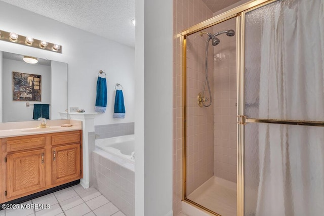 bathroom featuring vanity, tile patterned floors, independent shower and bath, and a textured ceiling