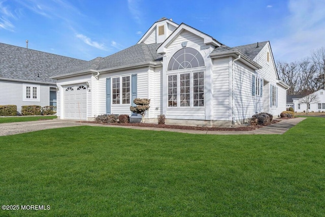 view of front of property featuring a garage and a front lawn