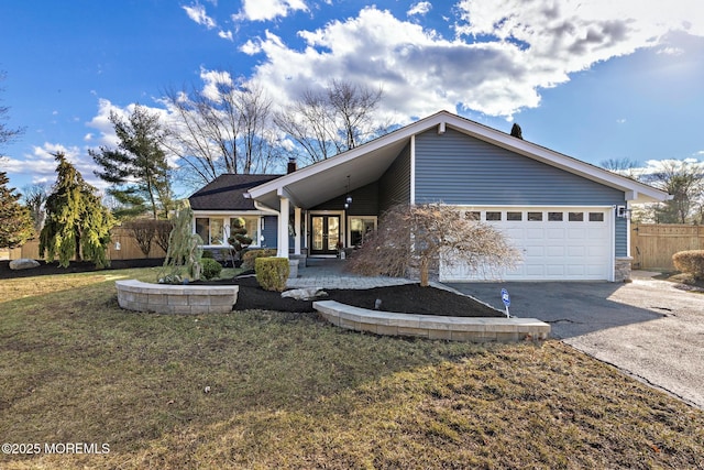 view of front facade featuring a garage, a porch, and a front lawn