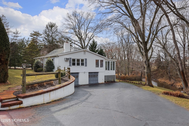 view of side of home with a garage