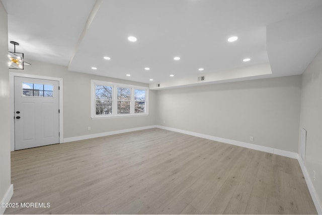 foyer with light hardwood / wood-style floors